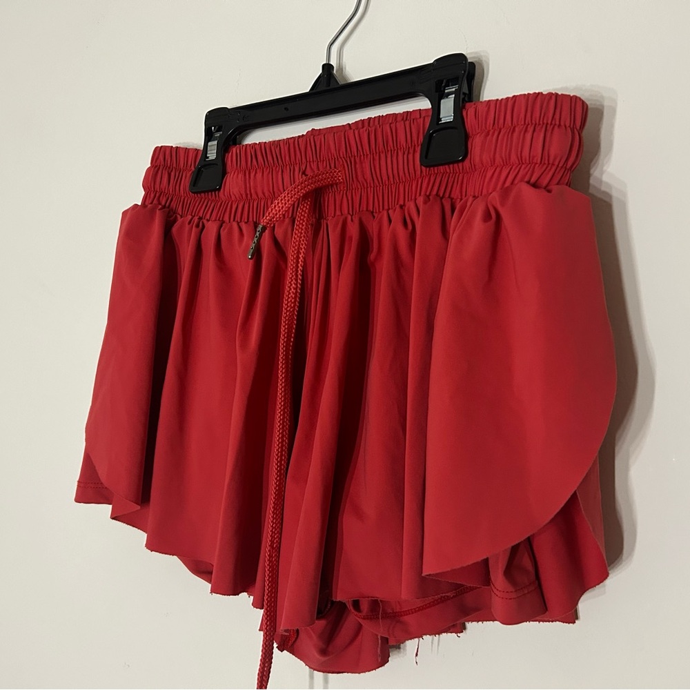 Red flowy athletic shorts